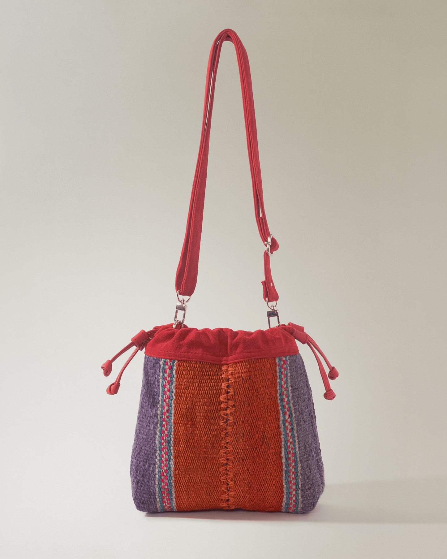 Bolso Puriy rojizo y naranja