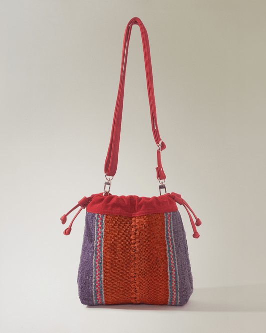 Bolso Puriy rojizo y naranja