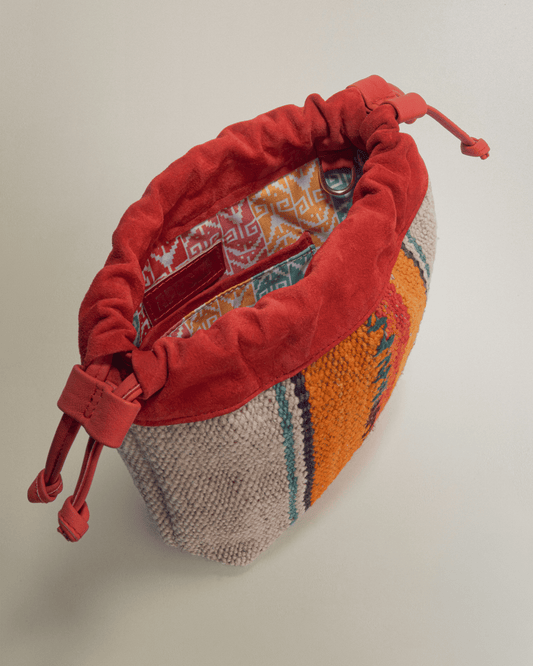 Bolso Puriy rojizo y naranja